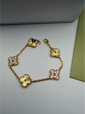 Elegant Gold Tone Clover Link Bracelet with Crystal Accents